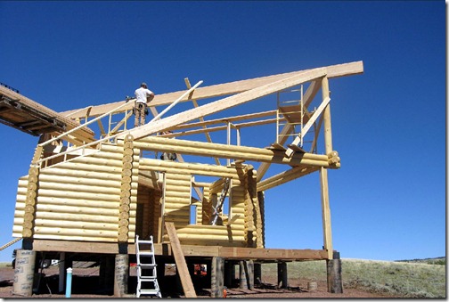 The crew is now laying out the roof diaphragm, using boards to match up the pitch. Each rafter will be measured for, and specially cut. Rotating the roof made for some extra work, but the visual impact is much for striking. This is a simple floor plan, and a small home, but by removing portions out of the entry gable, and rotating the roof 45 degrees, we’ve achieved a visual interest that the typical little box does not have. 