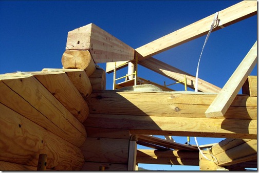 This connection is where the chamfered glulam barge rafter comes into the log wall. This approach was arrived at because of the differential settling that occurs on the gable wall. By separating the structural portions that settle at different rates, we can control how everything settles. 